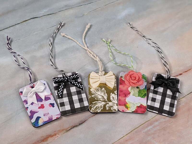 A set of five reusable gift tags with patterned designs on one side, and a chalkboard on the back.